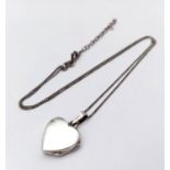 A 925 silver heart locket pendant on silver chain. Total weight 4.2G. Total length 46cm.