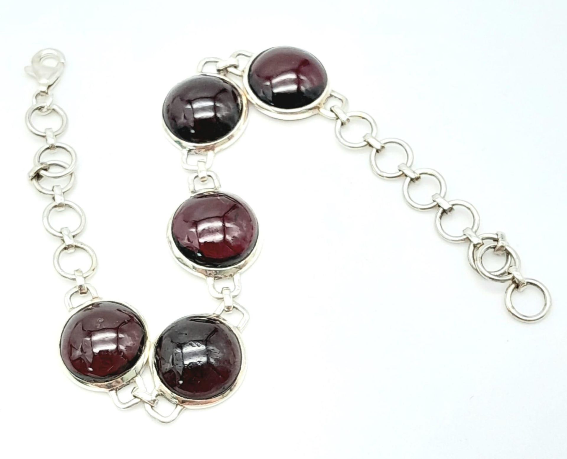 A Sterling Silver Red Stone Cabochon Set Bracelet. 19cm Length. 1.3cm Width. Gross Weight 12.75 - Image 2 of 10