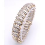 A BEAUTIFUL HEAD-TURNING 14K YELLOW GOLD DIAMOND TENNIS BRACELET WITH A MIXTURE OF ROUND AND