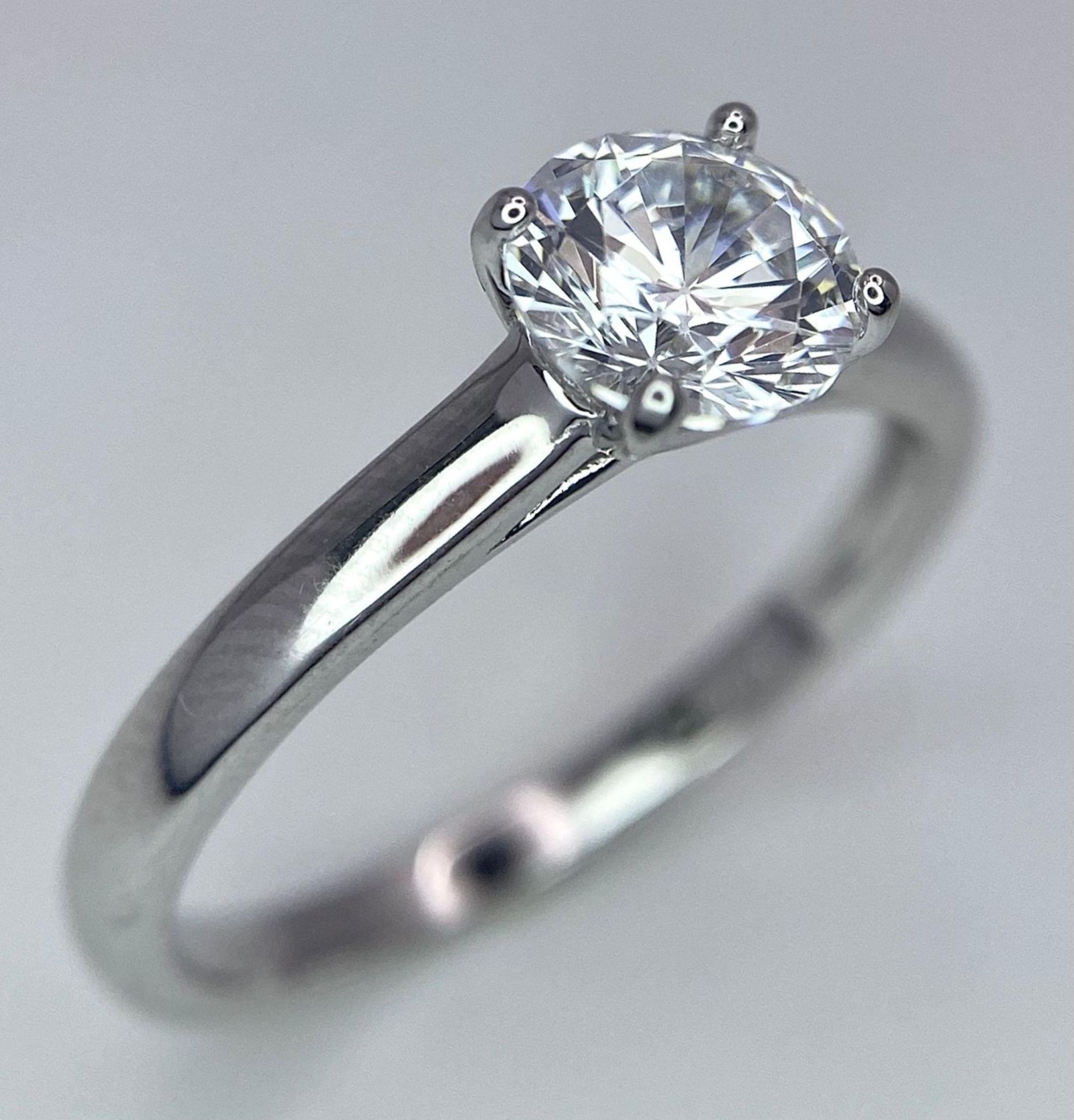 A sterling silver solitaire ring with a round cut cubic zirconium. Size: N, weight: 2 g. - Bild 3 aus 16