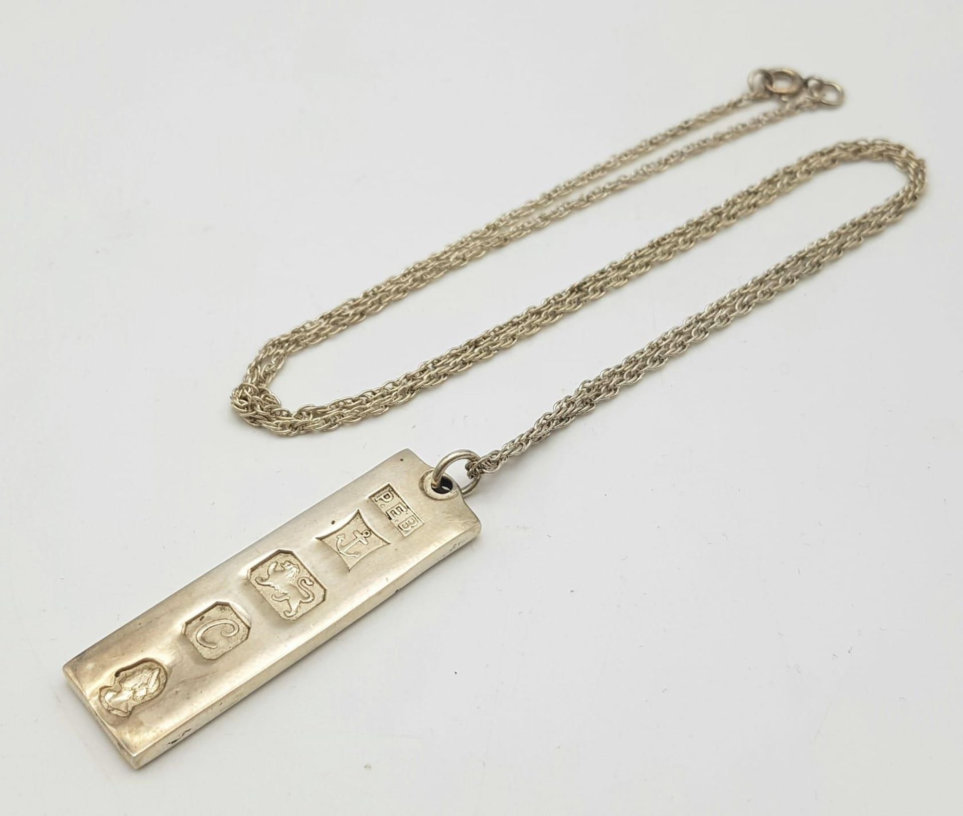 A Hallmarked 1977 (Jubilee Year) Silver Ingot Pendant Necklace. Pendant Measures 4.5cm Length on