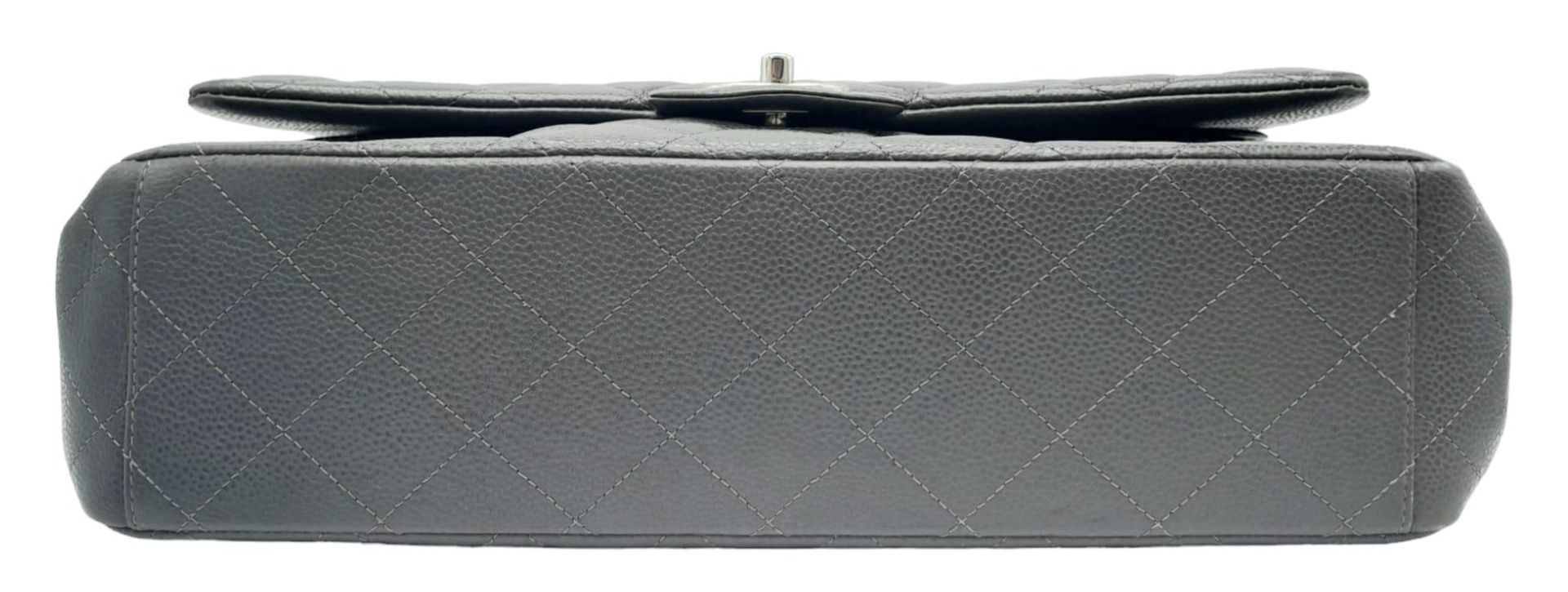 A Chanel Jumbo Double Flap Maxi Bag. Dark grey quilted caviar leather exterior with a large slip - Image 7 of 12