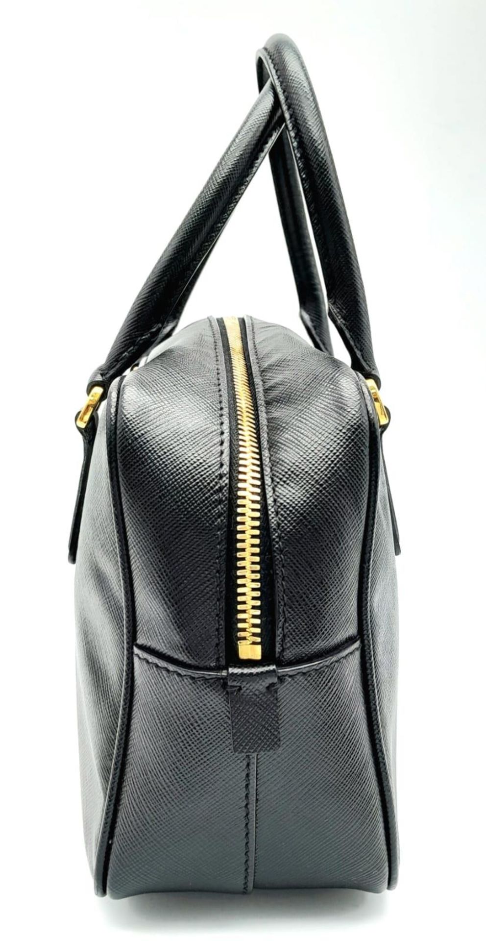 A Prada Black Bauletto Handbag. Saffiano leather exterior with gold-toned hardware, padlock, 2 - Bild 2 aus 11