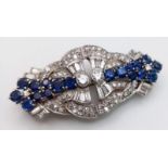 A Glamourous 9K White Gold Art Deco Style Double Clip Brooch. 4ctw of different cut quality diamonds