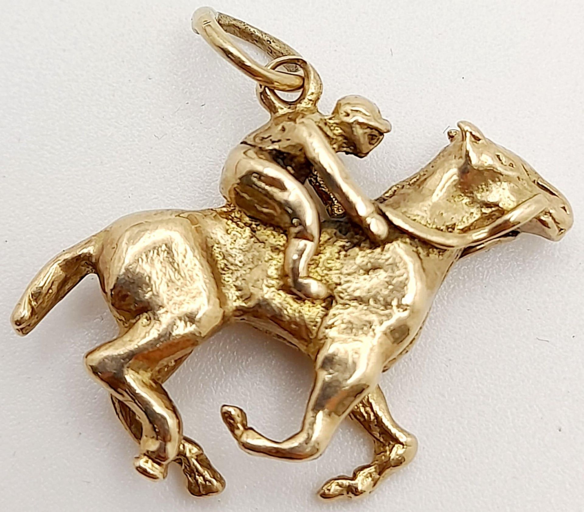 A Jockey and Racehorse 9k Yellow Gold Pendant/Charm. 2.5cm. 4.9g