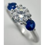 A 1ct White Moissanite and Sapphire Ring set in 925 Silver. Size P. Comes with a GRA certificate.