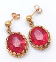 A PAIR OF FABULOUS 14K GOLD AND RUBY EARRINGS . 4.6gms