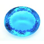 A large (162.81 carats), oval cut natural topaz, with vivid sky blue uniform colouration,