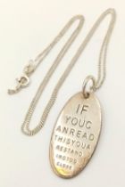 A vintage 925 silver pendant with engraving messages " If you can read this you are standing too