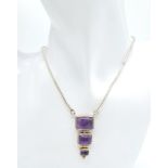 A Vintage Sterling Silver, Graduating Size, Amethyst Set Necklace. 40-43cm Length. Gross Weight 19.