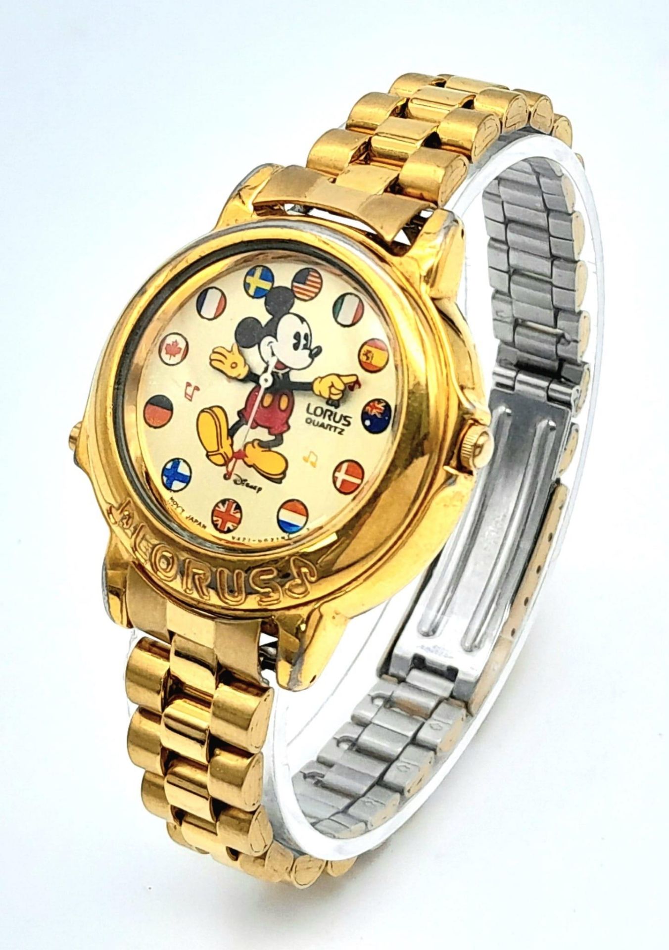 A Lorus Mickey Mouse Musical Quartz Watch. Gilded stainless steel bracelet and case - 34mm. MM