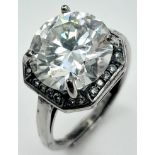 A 5ct Brilliant Round Cut White Moissanite Ring - Set in 925 silver. Size M. Comes with a GRA