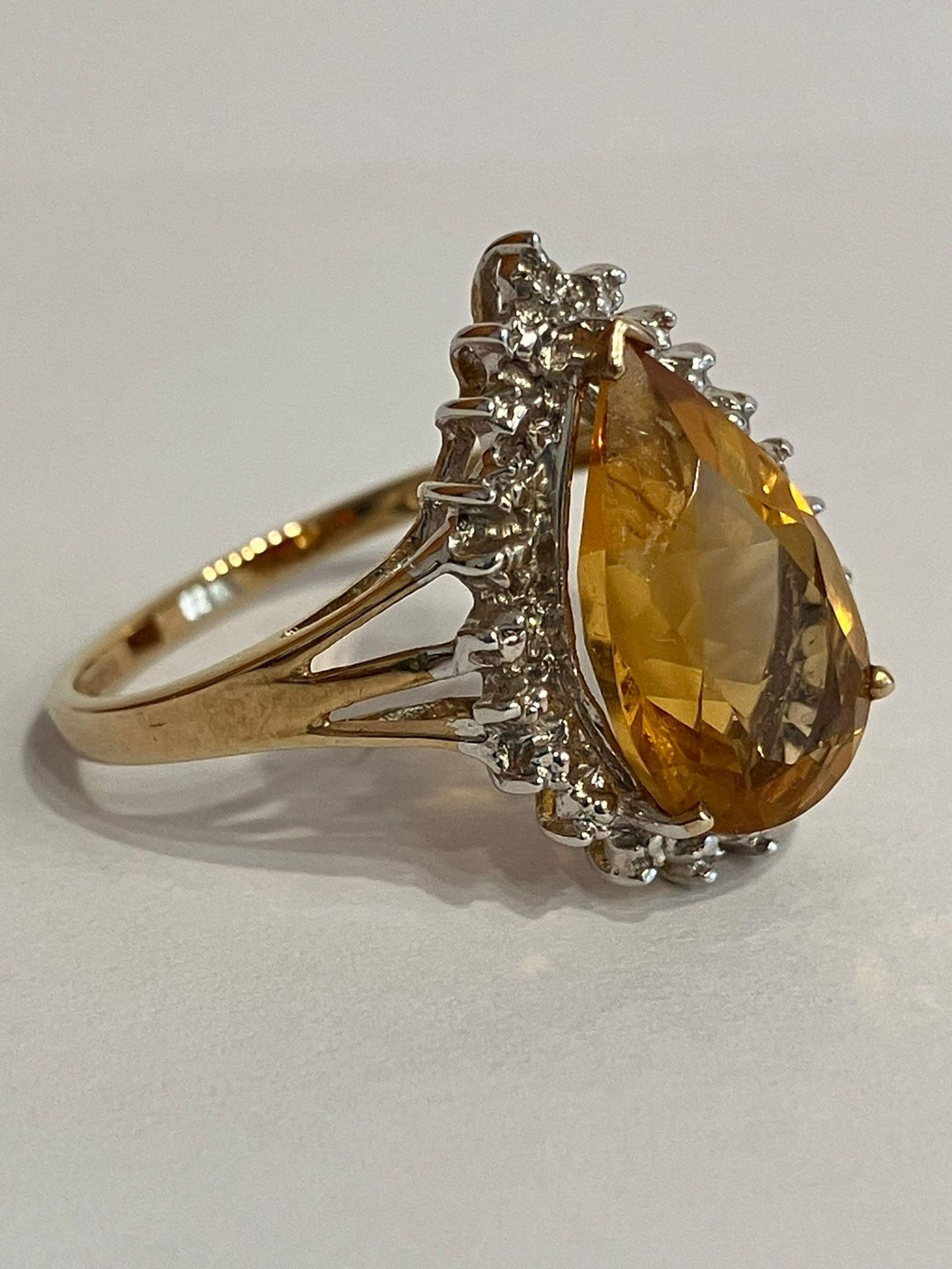 Stunning 9 carat GOLD and ORANGE TOURMALINE RING. Having a large ( 3 carat ) Pear Cut Orange