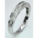 A 9K WHITE GOLD DIAMOND BAND RING. 0.40CTW. 2.7G. SIZE N.