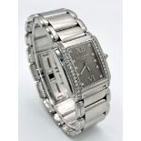 A Stunning Patek Philippe Diamond Twenty - 4 Ladies Watch. Stainless steel bracelet and case - 25