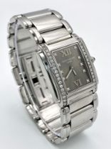 A Stunning Patek Philippe Diamond Twenty - 4 Ladies Watch. Stainless steel bracelet and case - 25