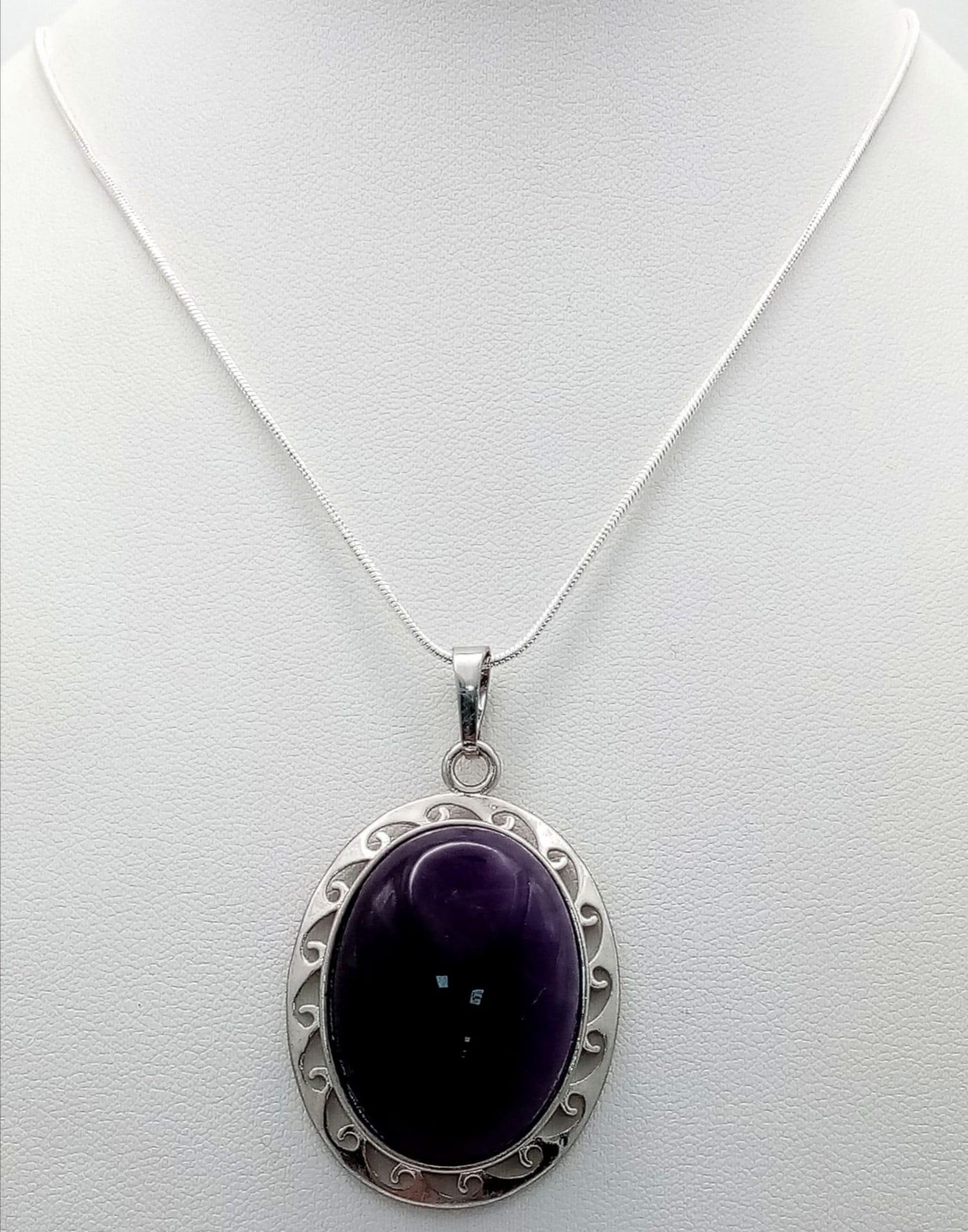 An Amethyst Oval Pendant on a 925 Silver Necklace. 5cm and 42cm.