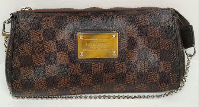 A Louis Vuitton Damier Ebene 'Eva' Pochette Shoulder Bag. Leather exterior with gold-toned hardware,