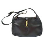 A Gucci Brown Jackie Bag. Leather exterior with gold-toned hardware, adjustable strap and push