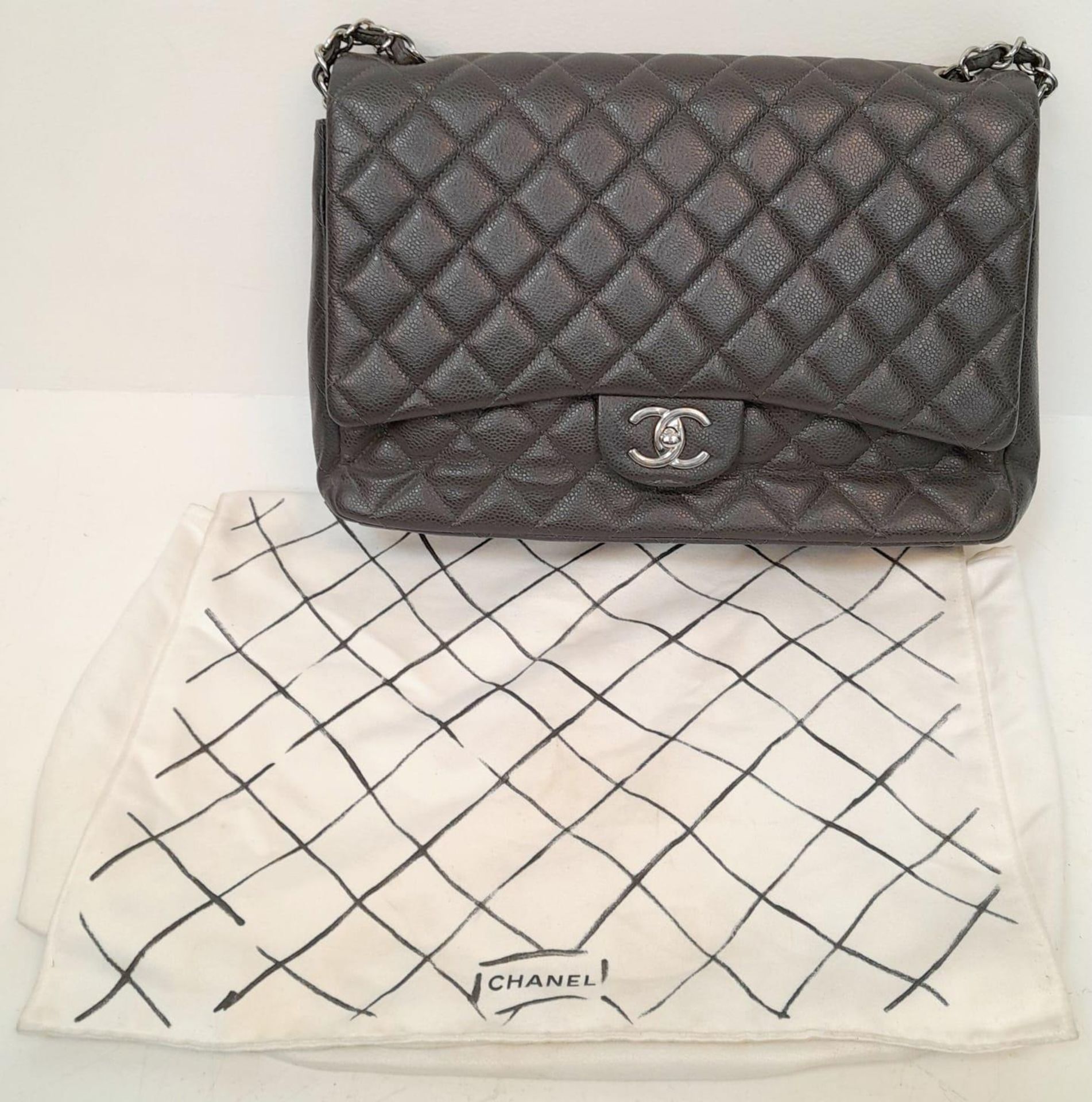 A Chanel Jumbo Double Flap Maxi Bag. Dark grey quilted caviar leather exterior with a large slip - Image 5 of 12