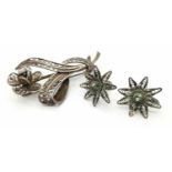 A matching set of sterling silver floral filigree brooch and a pair of screw earrings. Total