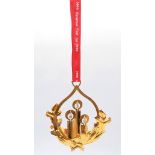 A Georg Jensen Gilded Christmas Ornament. 9cm x 12cm. On a hanging red ribbon. Comes in original