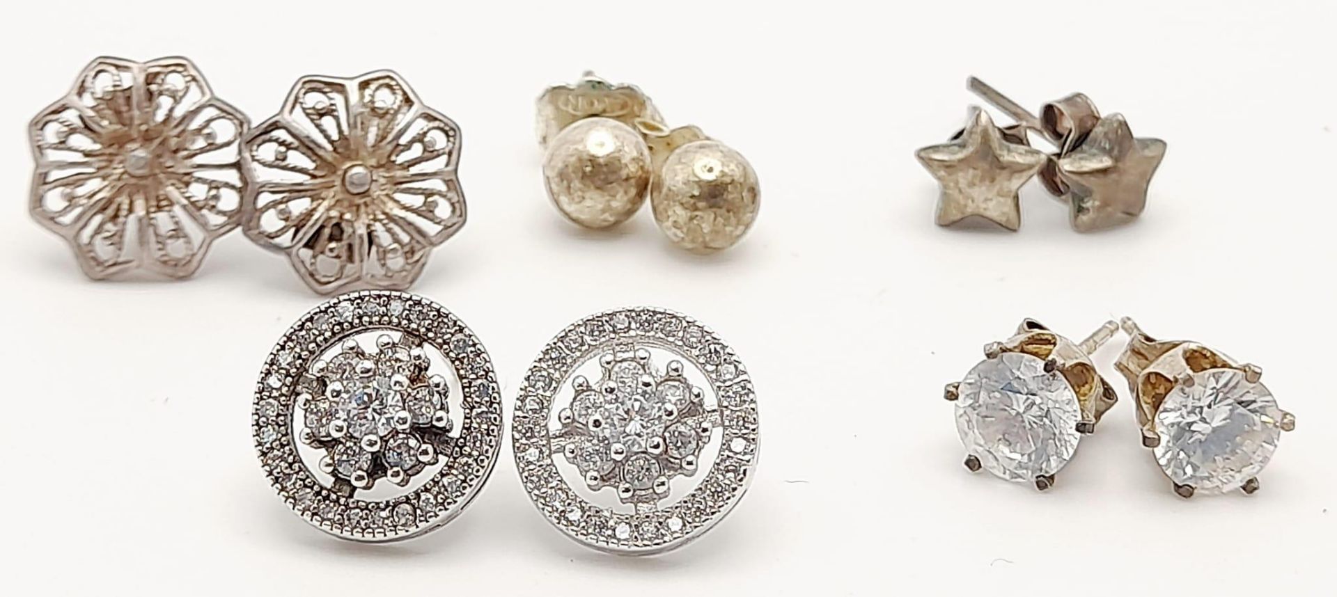 A collection of 5 stylish pairs of silver stud earrings. Total weight 7.1g. please see photos for