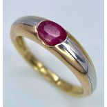 A 9K Yellow Gold Ruby Ring. Oval central ruby. Size N. 2.85g total weight.