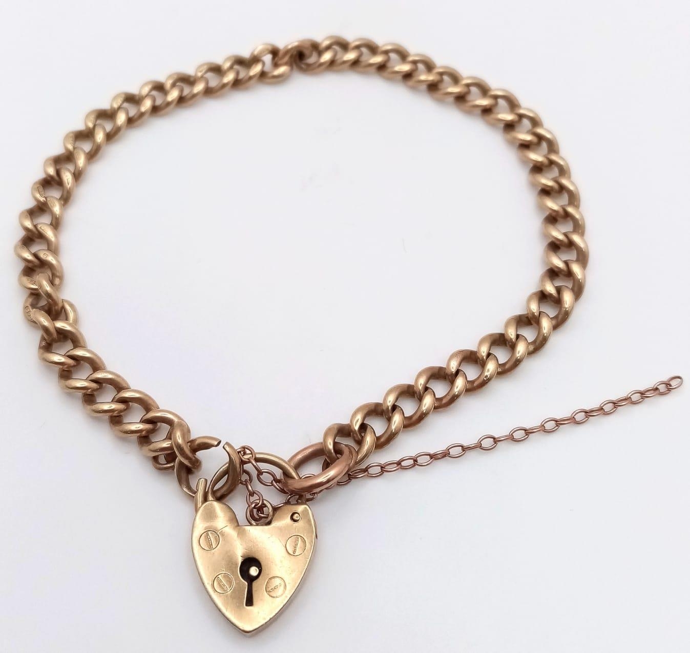 A Vintage 9K Yellow Gold Curb Link Bracelet with Heart Clasp. 20cm. 15.7g weight.