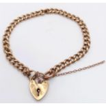 A Vintage 9K Yellow Gold Curb Link Bracelet with Heart Clasp. 20cm. 15.7g weight.