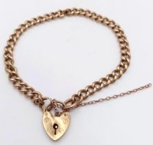 A Vintage 9K Yellow Gold Curb Link Bracelet with Heart Clasp. 20cm. 15.7g weight.