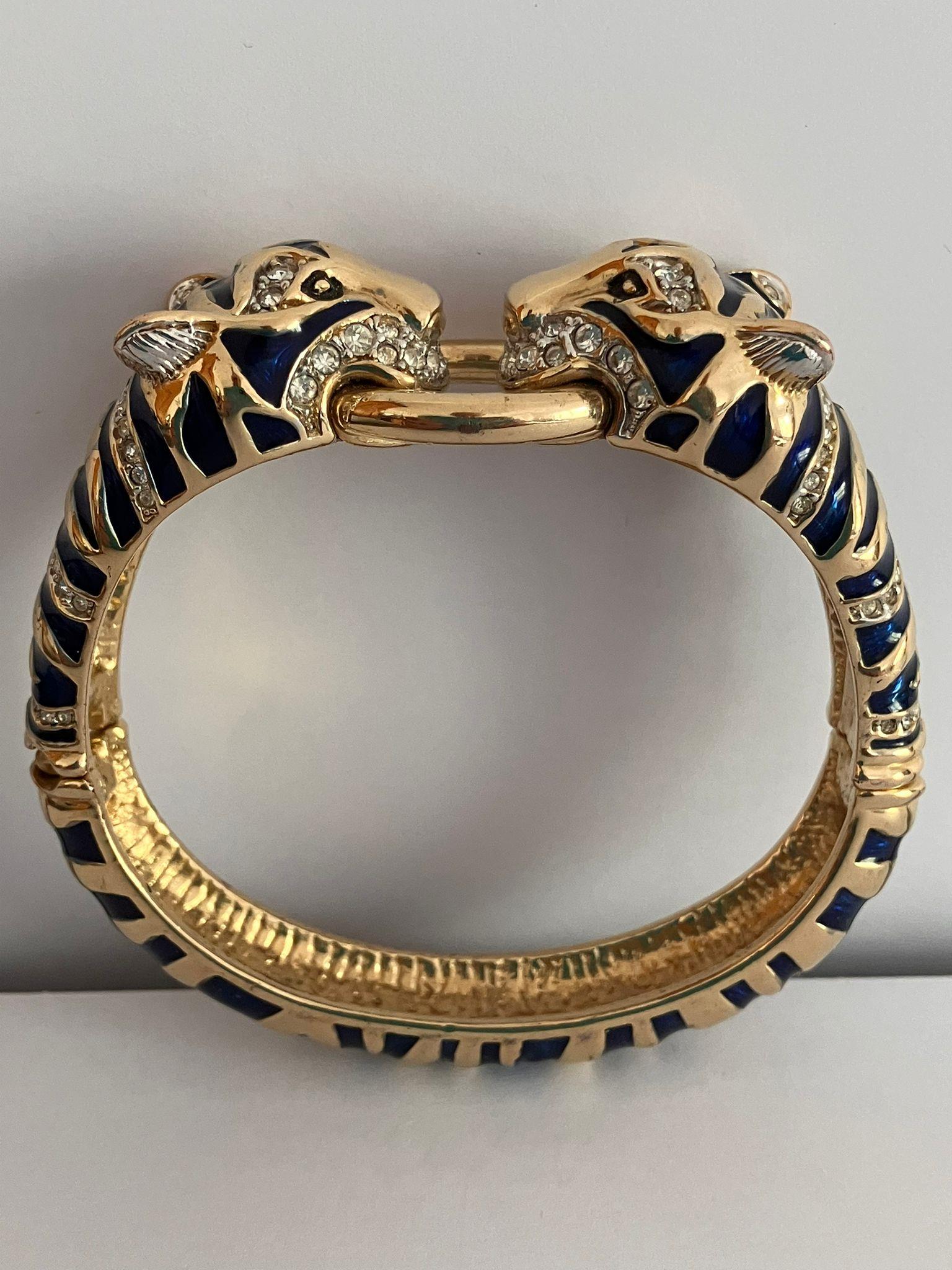 Vintage ‘Duchess of Windsor’ LEOPARD BANGLE. Heavily decorated with blue enamel and clear gemstones.