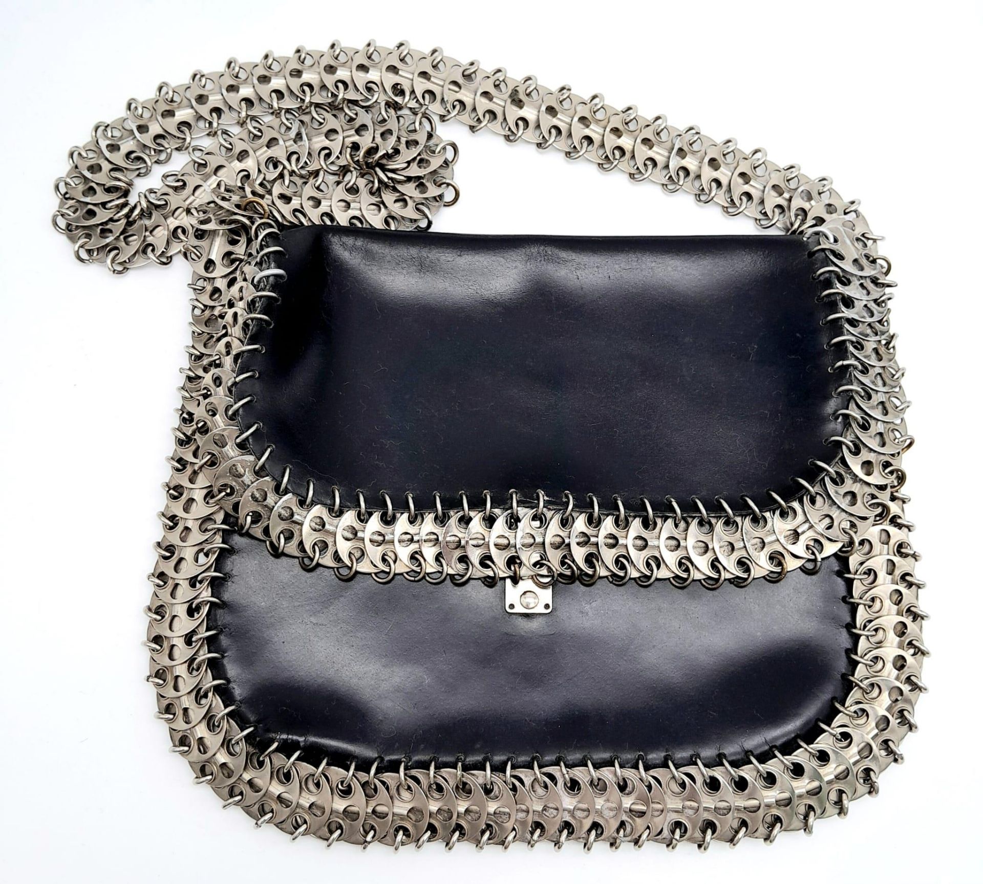 A Paco Rabanne Black 69 Chain Bag. Leather exterior with silver-toned perforated steel discs