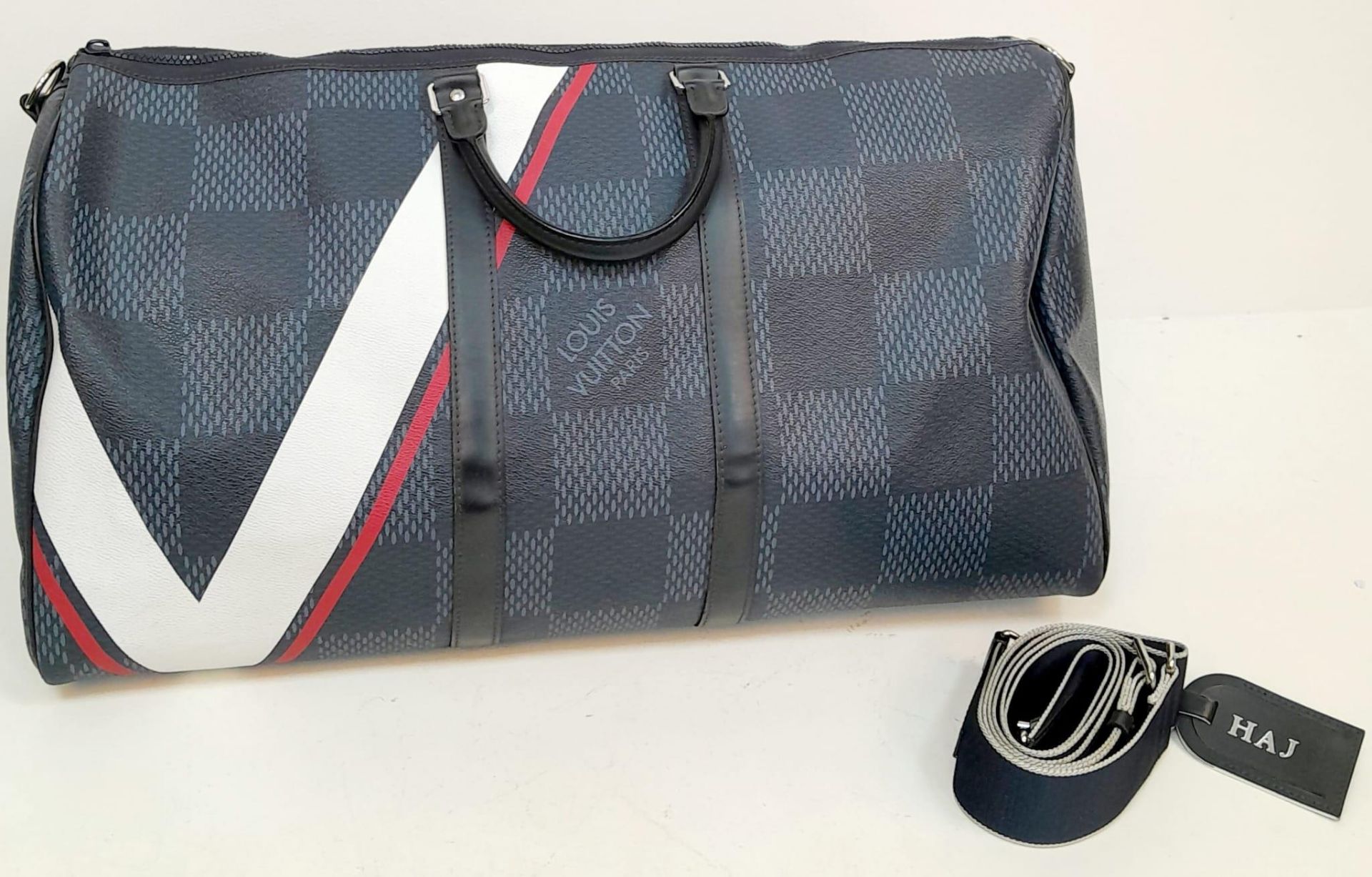 A Louis Vuitton America's Cup Oversized Keepall. Damier canvas in dark blue with a 'V' Gaston logo -
