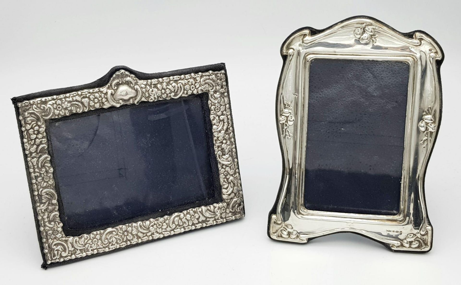 Two Sterling Silver Picture Frames - London and Birmingham hallmarks. 19 x 13cm and 17 x 15cm.