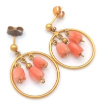 A VERY PRETTY PAIR OF 18K GOLD AND CORAL EARRINGS . 2.5gms