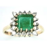 A 9K Yellow Gold Emerald with Diamond Surround Ring. Size K. 2g total weight.