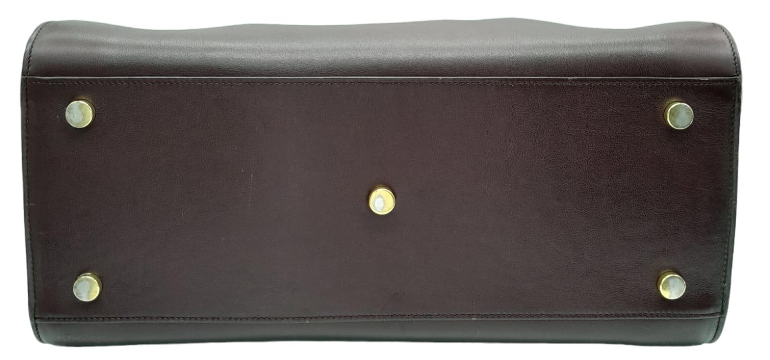 A Saint Laurent Sac De Jour Burgundy Handbag. Leather Exterior, Gold Tone Hardware, Double Handle in - Image 4 of 11