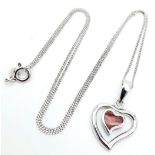 A Sterling Silver and Opal Pendant Necklace. 40cm Length. Pendant Measures 1.5cm Wide. Set with a