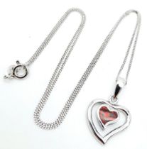 A Sterling Silver and Opal Pendant Necklace. 40cm Length. Pendant Measures 1.5cm Wide. Set with a