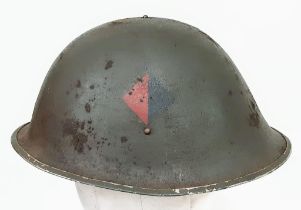 WW2 British 44 Pattern “Turtle” D-Day Helmet and liner, with insignia of the Royal Artillery.