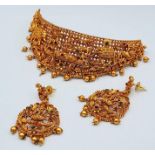 A South Indian traditional “Temple Jewellery” consisting of a necklace and matching earrings in an