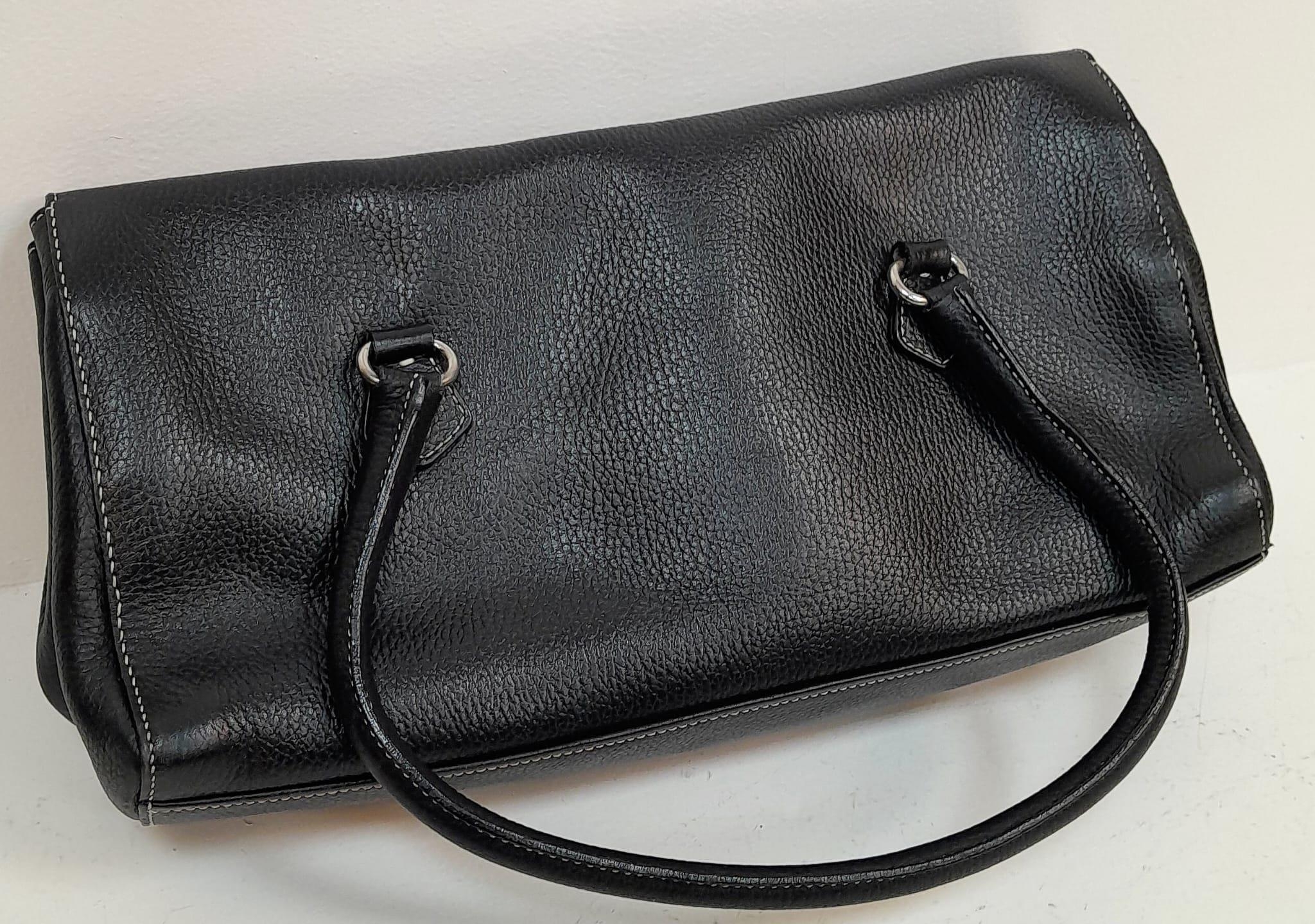 A Prada Black Shoulder Bag. Leather exterior with silver-toned hardware, two rolled leather - Image 3 of 7