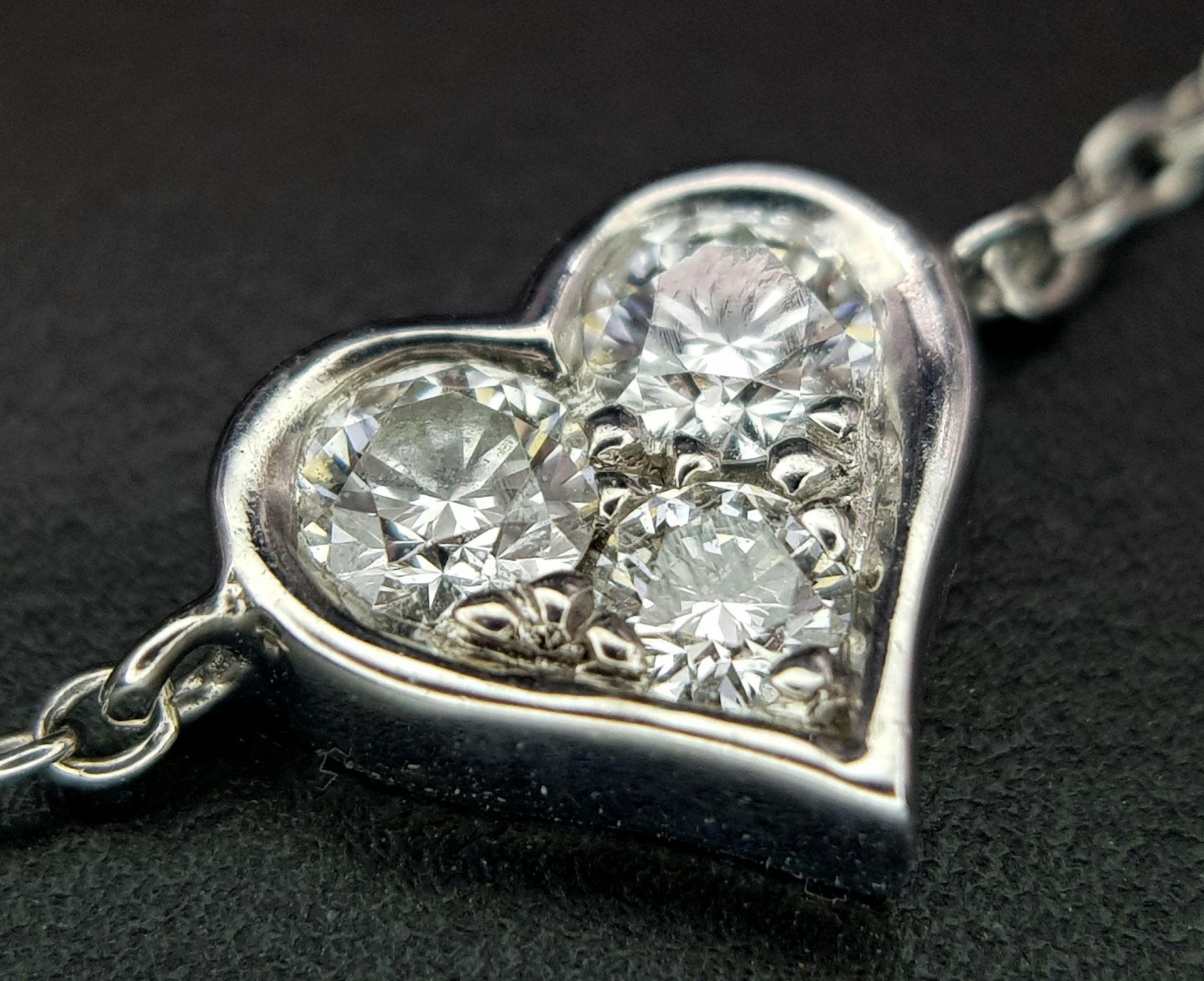 A 950 Platinum Delicate Tiffany and Co. Diamond Heart Bracelet. 16cm. 2.35g total weight. Ref: - Image 4 of 7