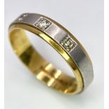 An 18K Yellow and White Gild Three Diamond Band Ring. 0.10ctw diamonds. Size O. 5.2g weight.