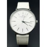 A Frederic Graff Ladies Quartz Watch. White leather strap. Stainless steel case - 38mm. White