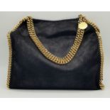 A Stella McCartney Black Falabella Shoulder/Tote Bag. Faux suede exterior with gold-toned heavy