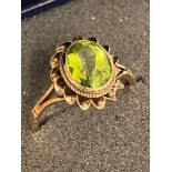 Impressive 9 carat GOLD and PERIDOT RING.Having a large OVAL PERIDOT set in an attractive Baroque