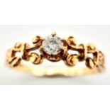 A 9K YELLOW GOLD FANCY DIAMOND SOLITAIRE RING. 0.15CT. 1.3G. SIZE N