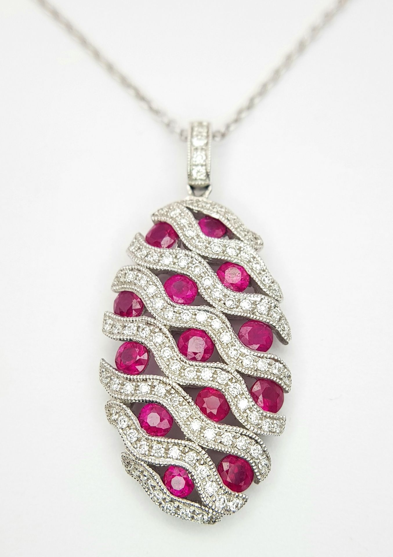 AN 18K WHITE GOLD DIAMOND AND RUBY PENDANT - 0.49CT OF DIAMONDS AND 2.29CT OF RUBIES. 6.2G WEIGHT. - Image 2 of 16